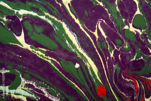 Ebru art. Traditional Turkish Ebru technique. Painting on water, followed by paper prints. Color paint ebru with waves and tile pattern.