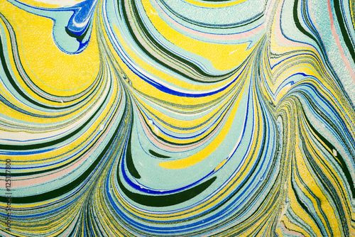 Ebru art. Traditional Turkish Ebru technique. Painting on water, followed by paper prints. Color paint ebru with waves and tile pattern.
