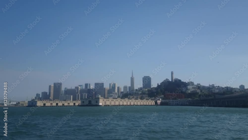 San Francisco, California - July, 2016 - Medium shot of the San Francisco skyline with the seen from a sailboat as it comes towards the marina. San Francisco, California - July, 2016 - Medium shot of the San Francisco skyline with the seen from a sailboat as it comes towards the marina.
