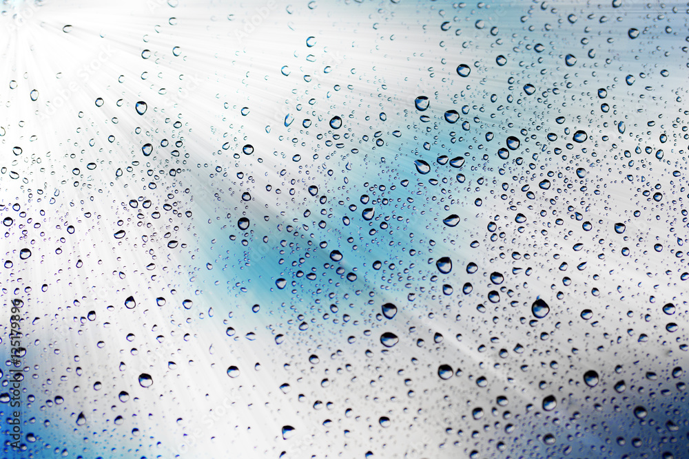 Abstract texture. Water drops on glass with sun background Abstract texture. Water drops on glass with sun background