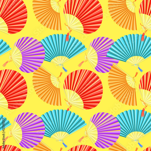 seamless pattern colorful Japanese fan of on a yellow background