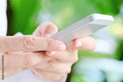 close up Image of Woman hand Using a Smart Phone background communication