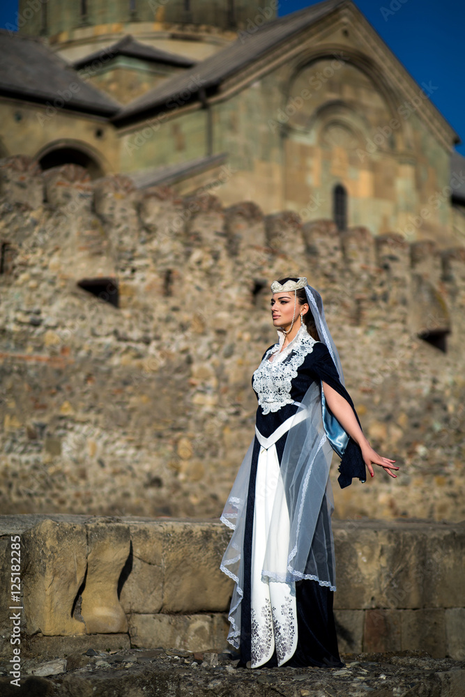 beautiful young Georgian girl near old castle beautiful young Georgian girl near old castle