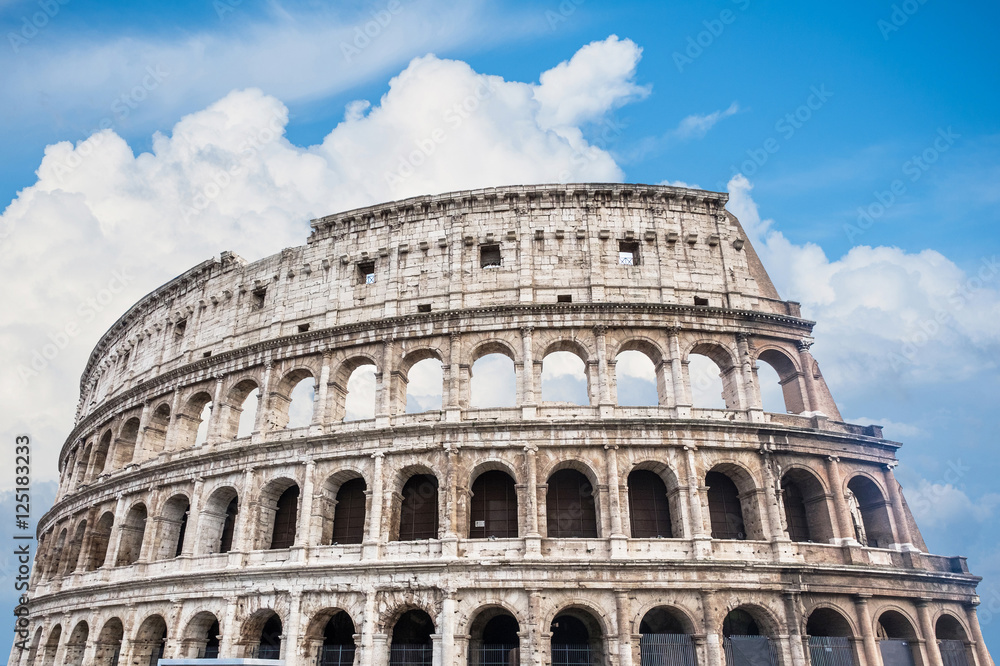 Colosseum in Rome, Italy on blue sky background