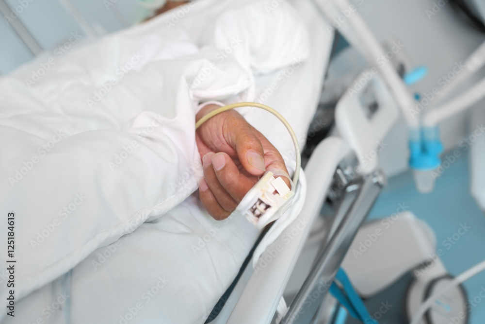 Hand of an elderly patient with a pulse sensor Hand of an elderly patient with a pulse sensor