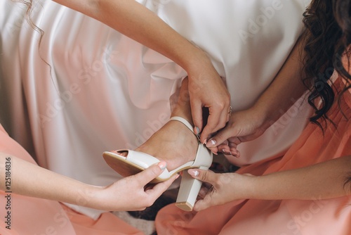 Bride dressing shoes.