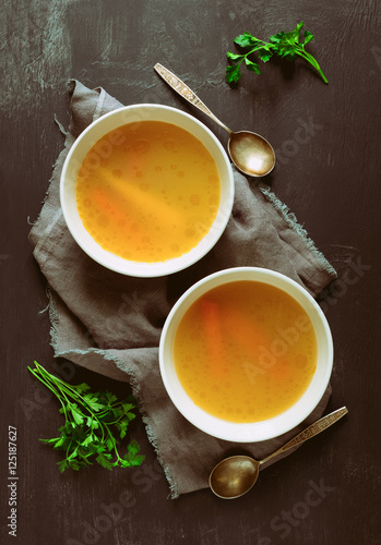 Bouillon served in two bowls photo