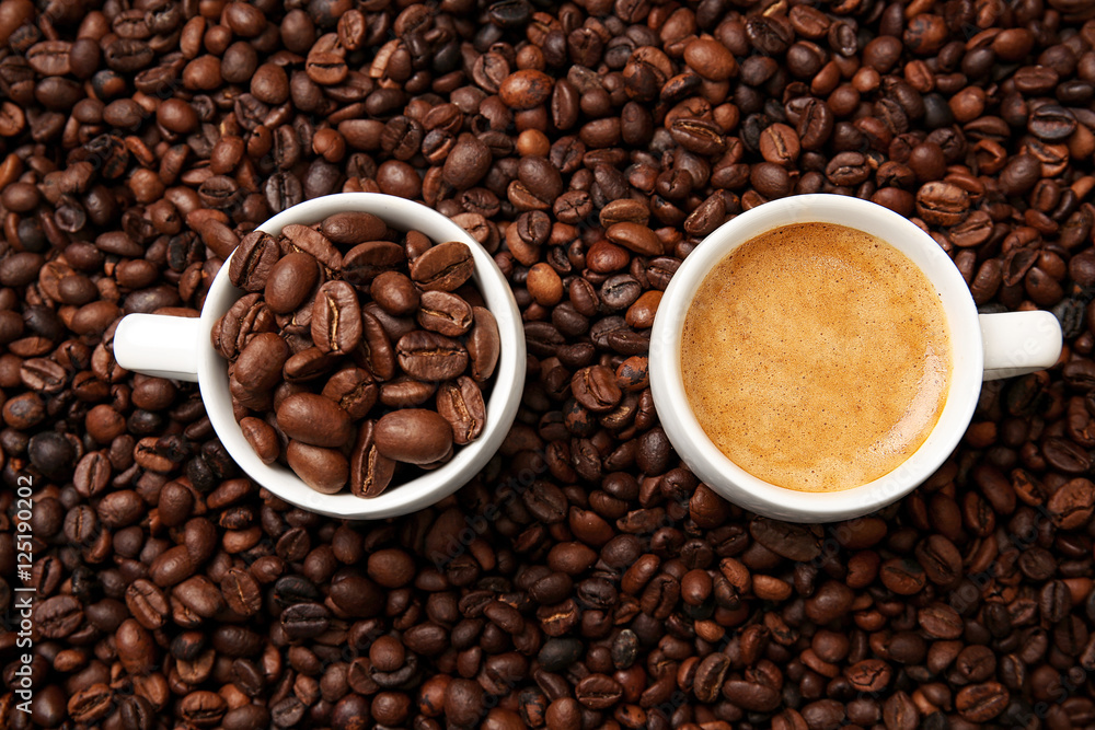 Cups with hot coffee and coffee beans, close up view Cups with hot coffee and coffee beans, close up view