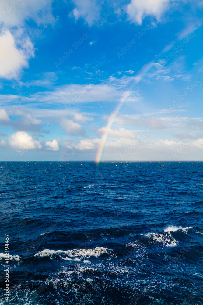 Rainbow Over Blue Sea