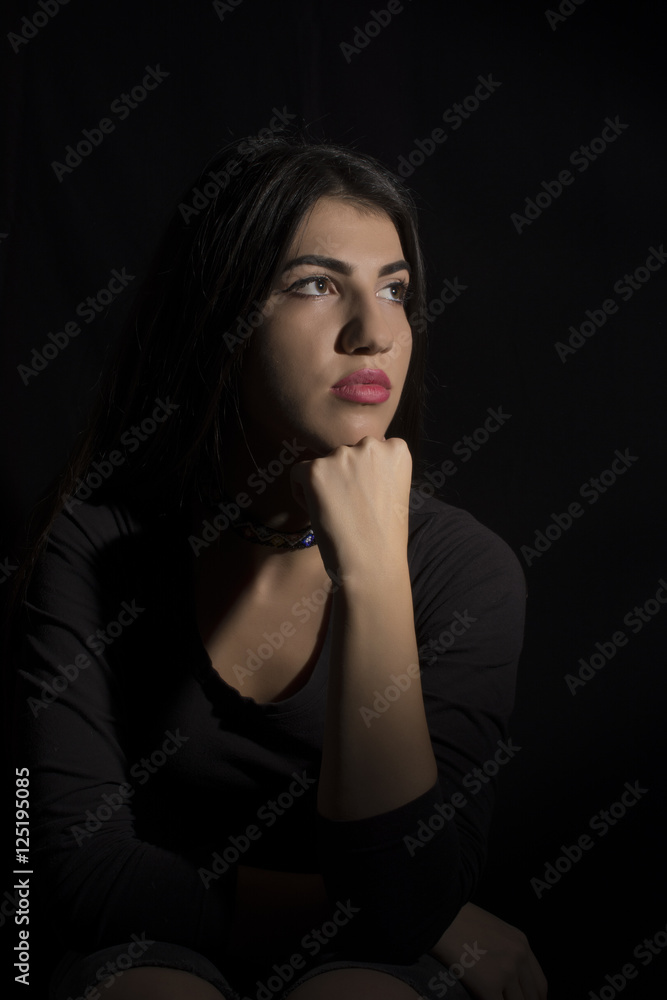 Young woman ,studio portrait on black background Young woman ,studio portrait on black background