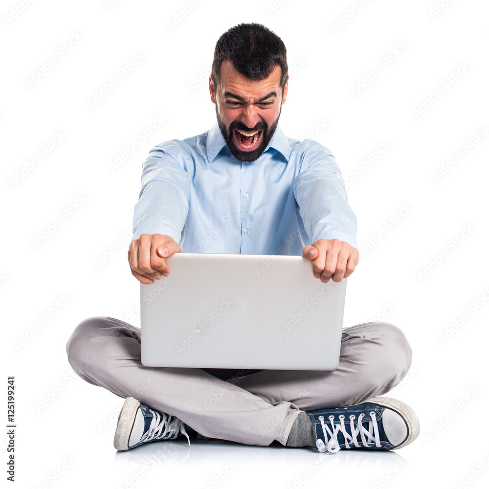 Angry man with laptop shouting Angry man with laptop shouting