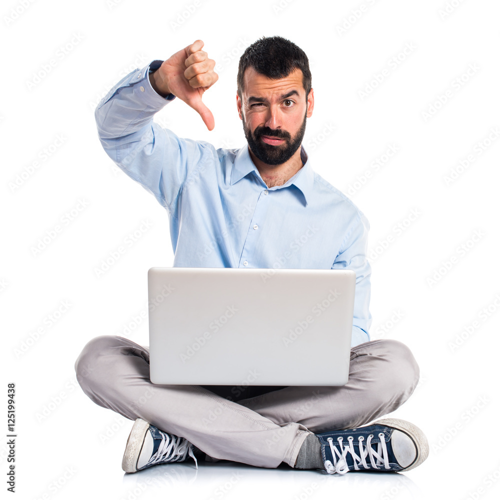 Man with laptop doing bad signal Man with laptop doing bad signal