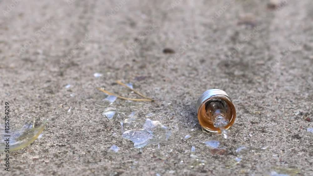 light bulb crashing against concrete light bulb crashing against concrete