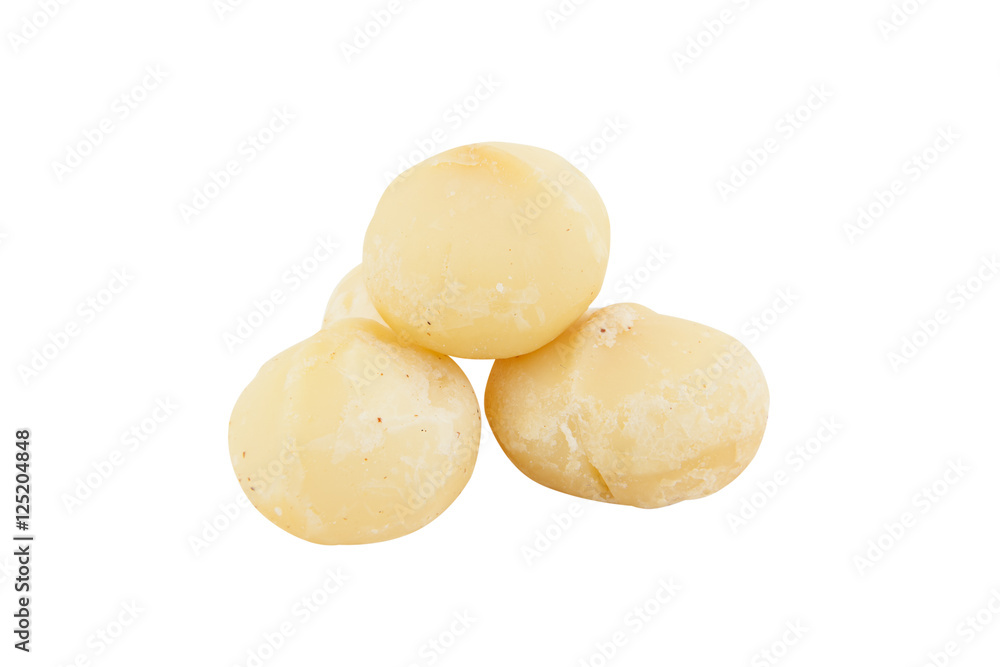 delicious macadamia nuts on plate on wooden background delicious macadamia nuts on plate on wooden background