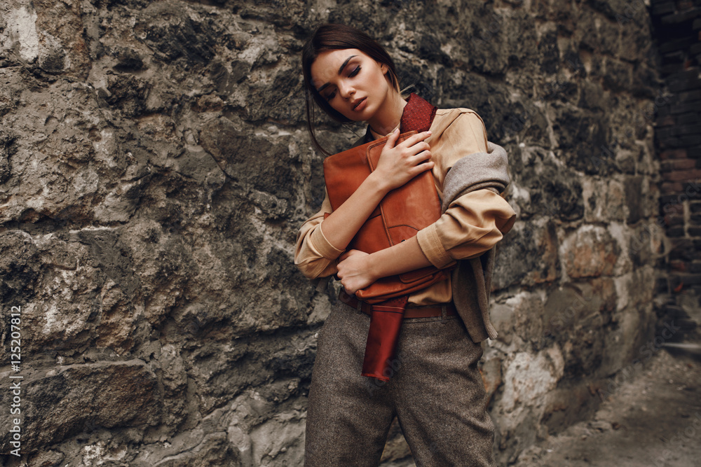 Beautiful Fashionable Woman In Fashion Clothing Posing Near Wall Beautiful Fashionable Woman In Fashion Clothing Posing Near Wall