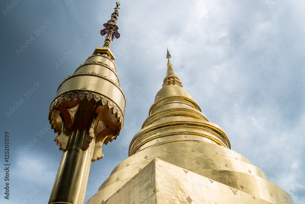 Fototapeta premium The golden pagoda of Wat Phra Singh is a Buddhist temple in Chiang Mai, Northern Thailand.