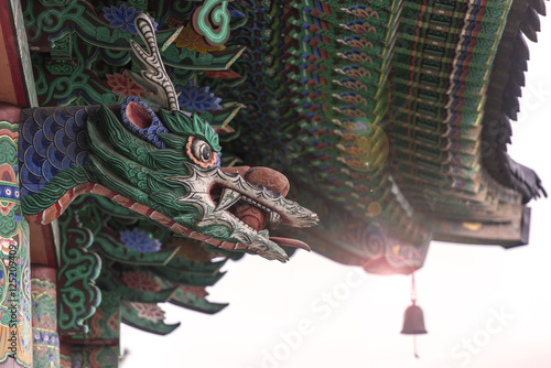 Traditional Asian wooden temple with Dragon over the main Entrance © Savvapanf Photo ©