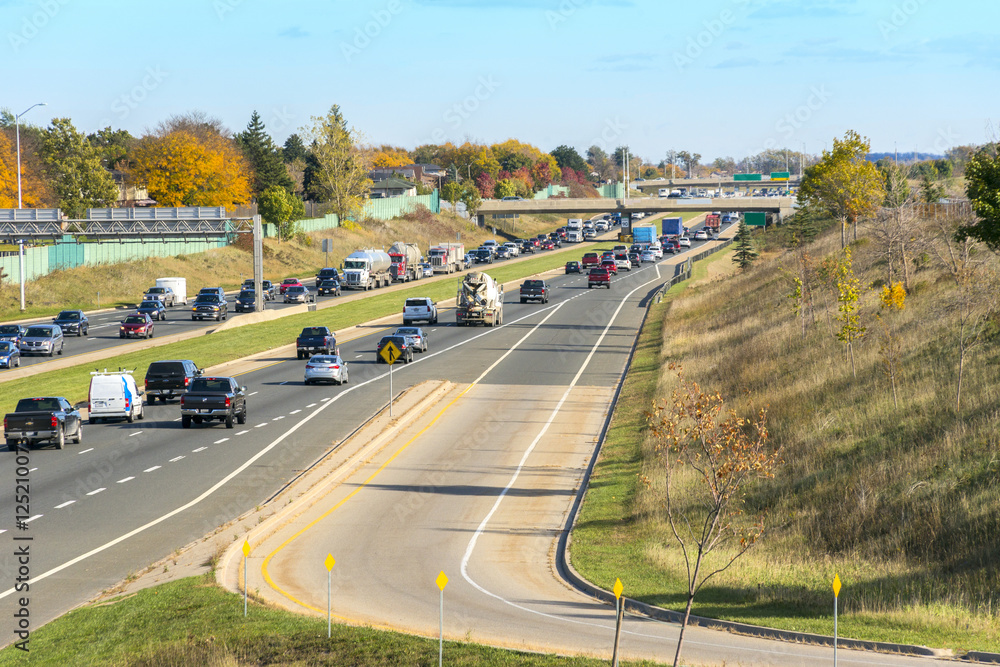Busy split highway running through a suburban area