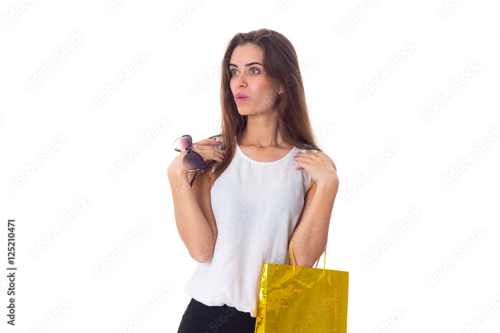 Woman with sunglasses and shopping bag