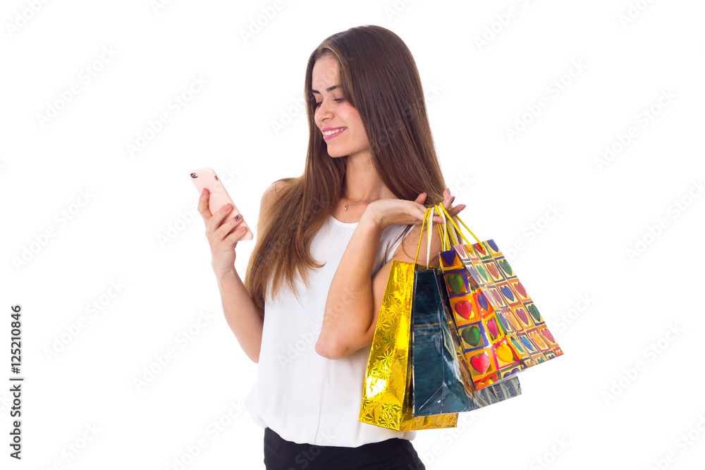 Woman with smartphone and shopping bags Woman with smartphone and shopping bags