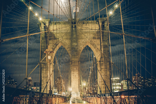 Brooklyn Bridge, New York City at night with vintage tone filter