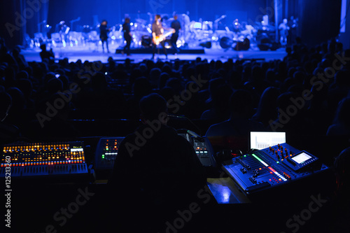 Obraz na płótnie Soundman working on the mixing console.
