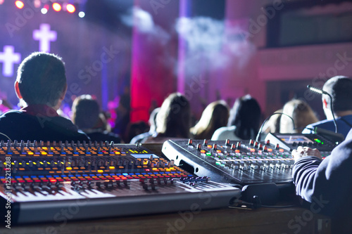 Obraz na płótnie Soundman working on the mixing console.