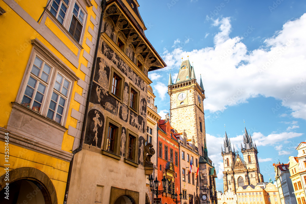 Fototapeta premium Cityscape view on the clock tower and Tyn cathedral in the old town of Prague