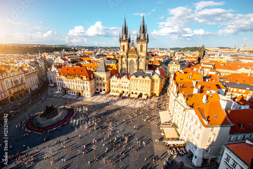 Top cityscape view on the old town square with Tyn cathedral during the sunny day in Prague photo