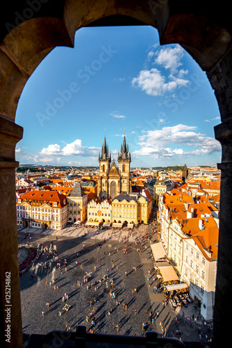 Top cityscape view on the old town square with Tyn cathedral during the sunny day in Prague photo