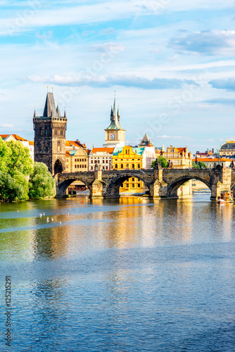 Canvas Print Citycsape view on the riverside with the bridge and old town in Prague