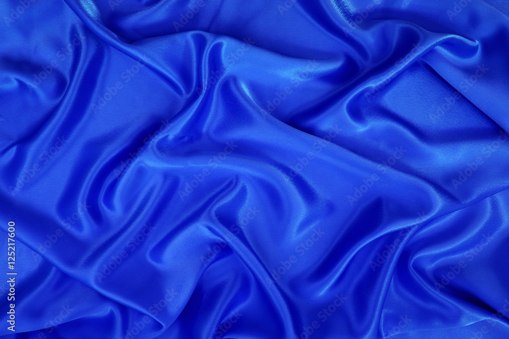 Obraz premium blue silk or blue satin textile fabric texture background