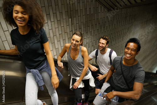 Canvas Print Group of friends having fun in subway stairs