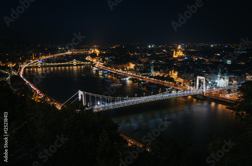 Panoramic View of Budapest and the Danube River from Gellert Hill Lookout Point at night © mykolastock