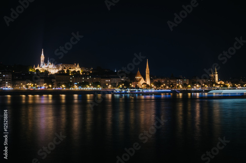 View of Fishermen Bastion and St. Matthias church nicely illuminated at night, Budapest, Hungary © mykolastock
