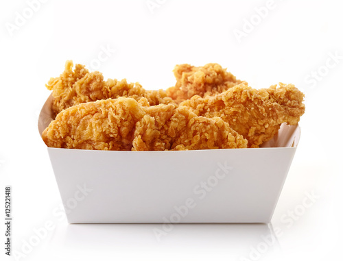 Fried breaded chicken fillet in white cardbord box