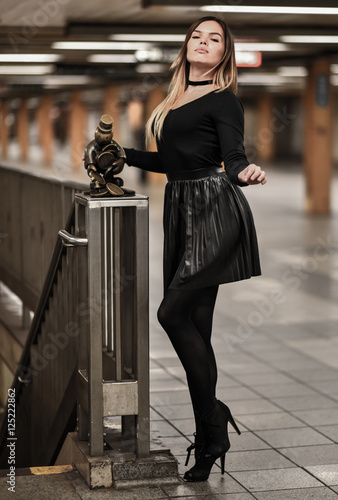 Young beautiful fashion model in NYC subway.