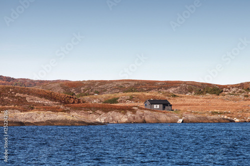 House on empty rocky coast in Norway