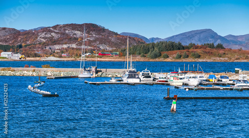 Yachts and boats moored in marina of Brekstad photo