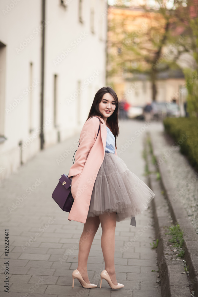 Young Asians girl with modern dress posing in an old Krakow Young Asians girl with modern dress posing in an old Krakow