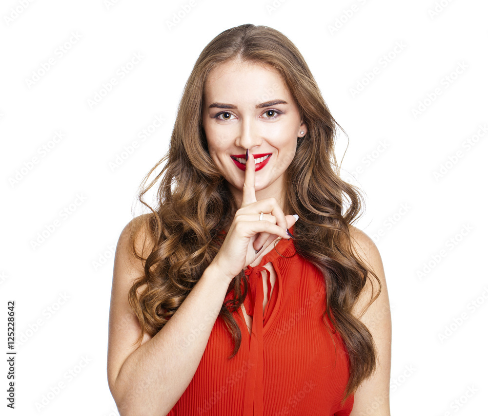 Young beautiful woman has put forefinger to lips as sign of sile Young beautiful woman has put forefinger to lips as sign of sile