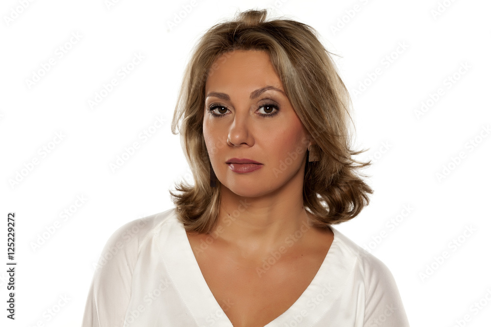 middle-aged beautiful woman looking with distrust middle-aged beautiful woman looking with distrust