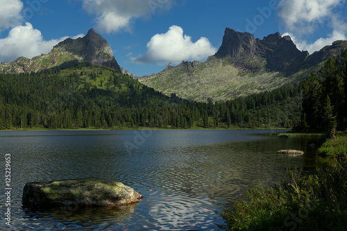Mountain Lake with rocks in the foreground. Lake Bright  Natural Park Ergaki  Western Sayan Mountains  Russia.