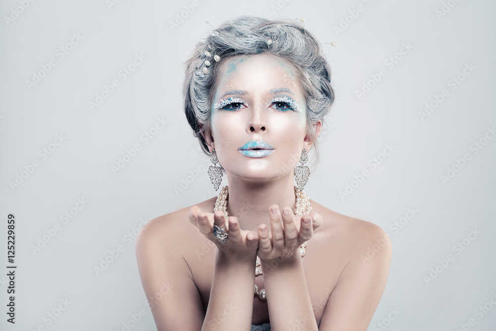Winter Woman Fashion Model with Snow Glitters Makeup Blowing a K Winter Woman Fashion Model with Snow Glitters Makeup Blowing a K