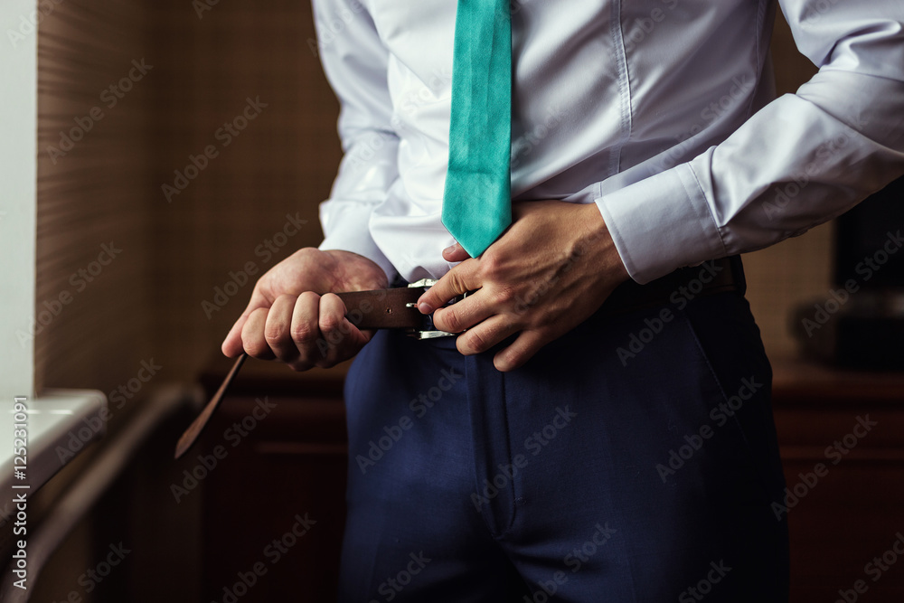 man putting on a belt, Businessman, Politician, man's style, mal man putting on a belt, Businessman, Politician, man's style, mal