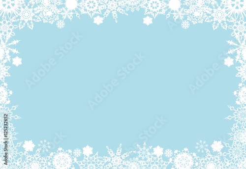 Christmas frame from white snowflakes on a blue background  