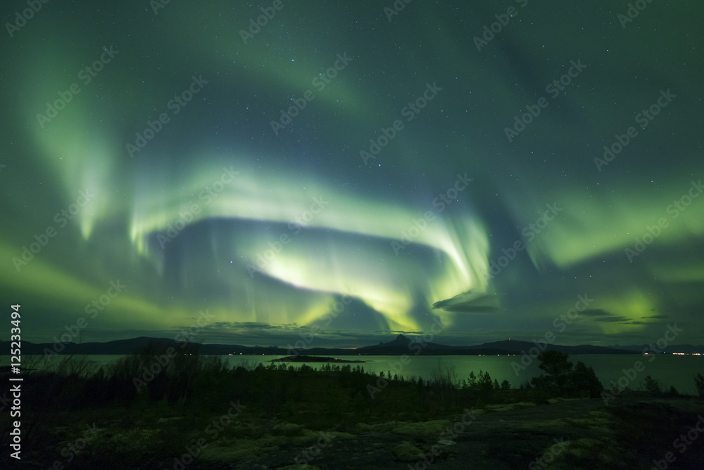 Aurora across night scenery