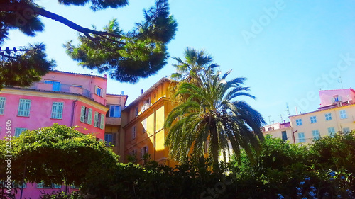 facades of old buildings with vivid wall paintings in Menton  France 