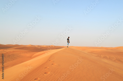 man in the setting sun in the desert © rewazk