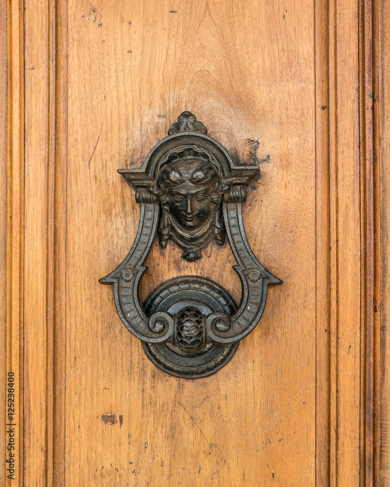 Door knoker on an old wodden door Door knoker on an old wodden door